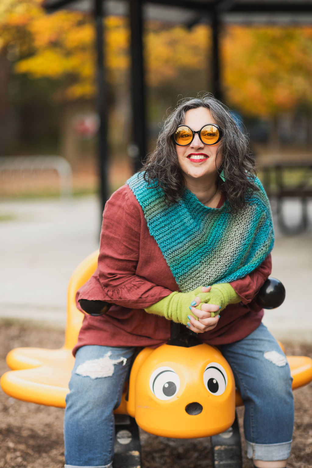 photo of Danette leaning against graffiti wall